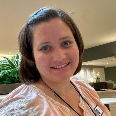 unnamed-1 a seedling supported by a wooden dowel in a pot to show the concept of support.