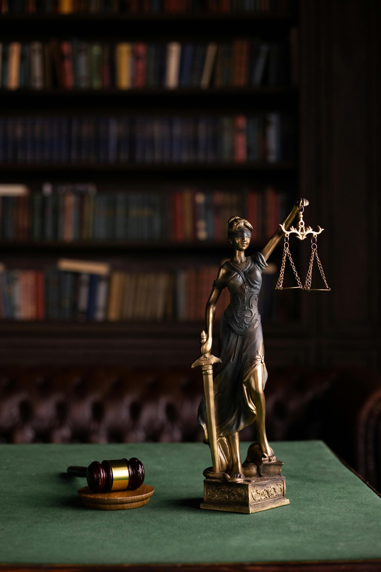 a gavel, two books, and a scale representing law and justice.